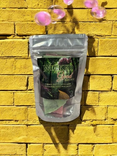 Wicked Good Brickle package in resealable bag - green forest, pink flowers, yellow brickle road