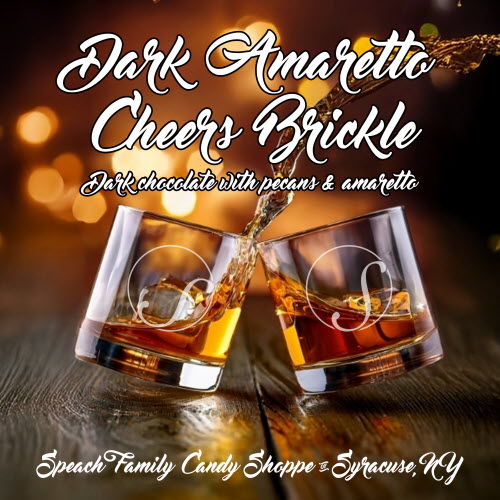 amarettocheers label two rocks glasses clinking on a wooden table.