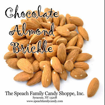 chocolate almond brickle roasted almonds piled up on white background