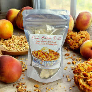 Peach Cobbler Brickle bag with peaches and granola on countertop