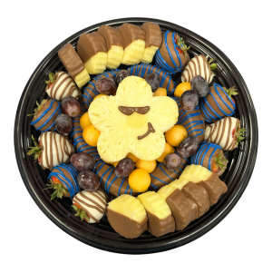 Fruit platter with pineapple daisy and funny face, chocolate covered strawberries and apples with melon and grapes.